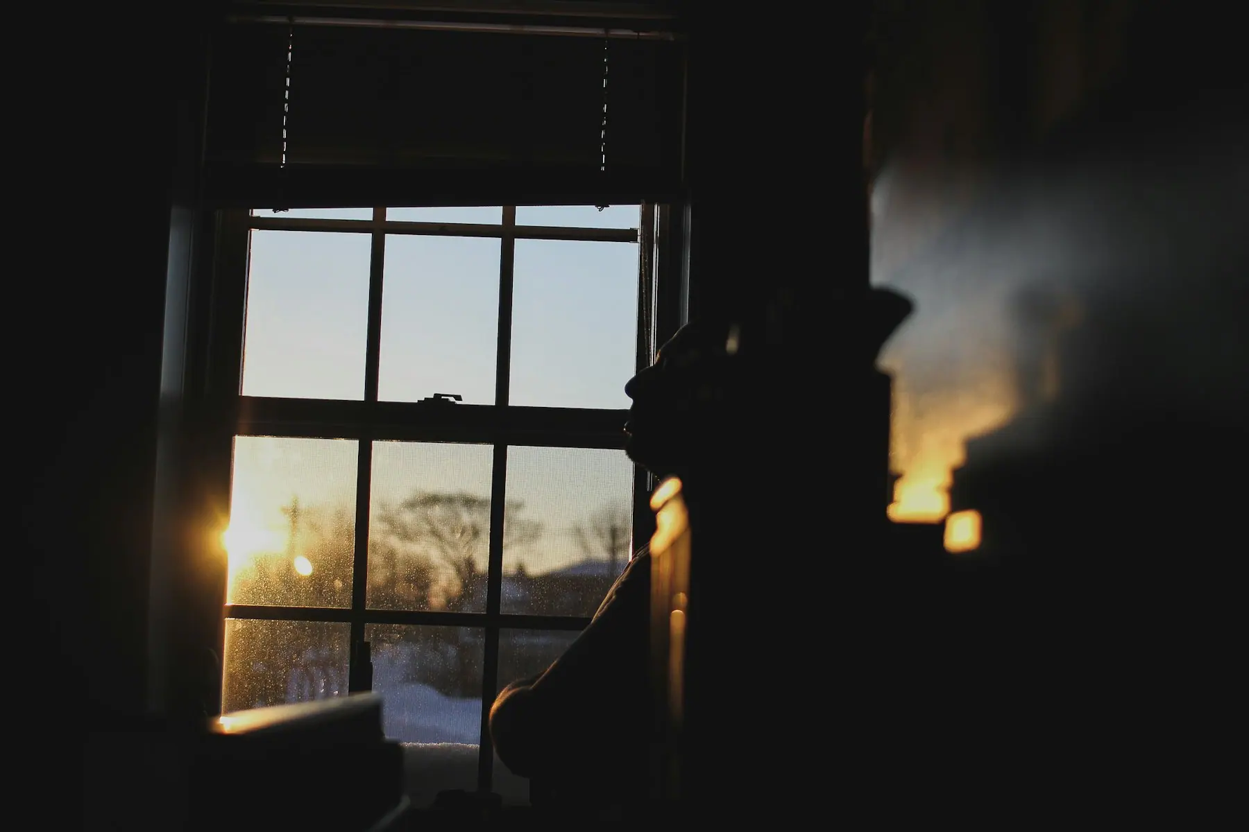 Morning light falling across a window and a cup of tea