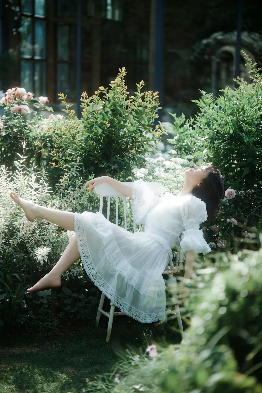 A guest resting outdoors surrounded by greenery