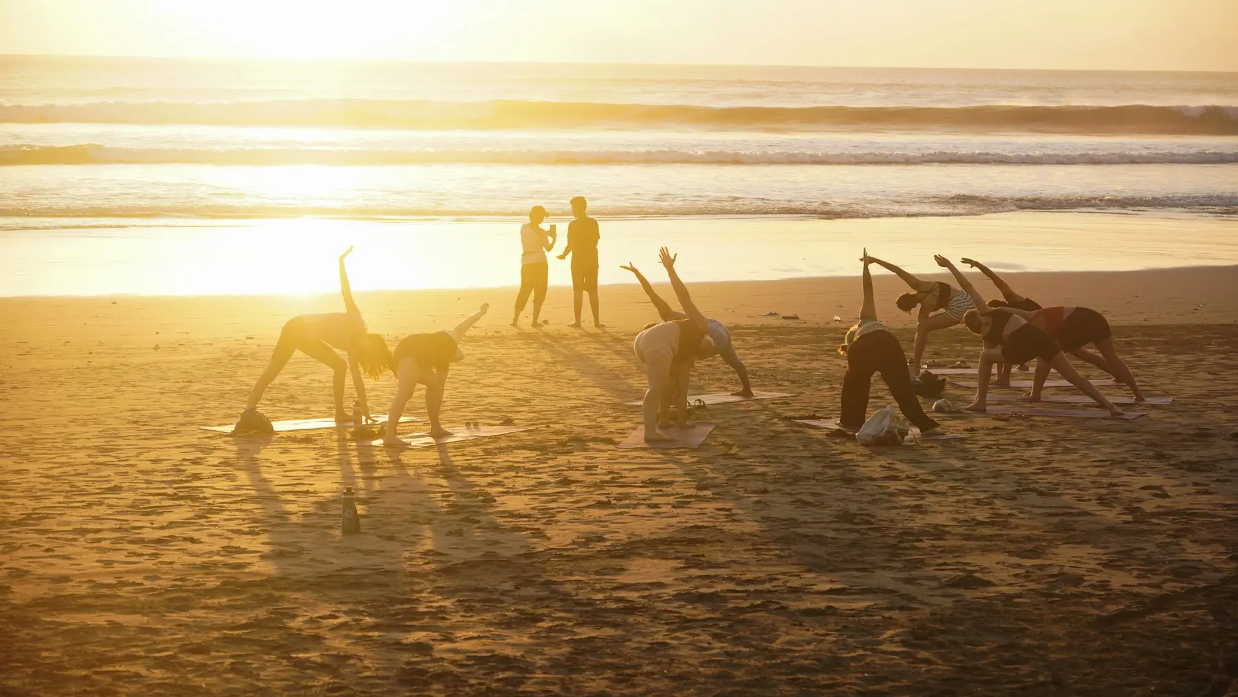 An outdoor yoga session at sunrise