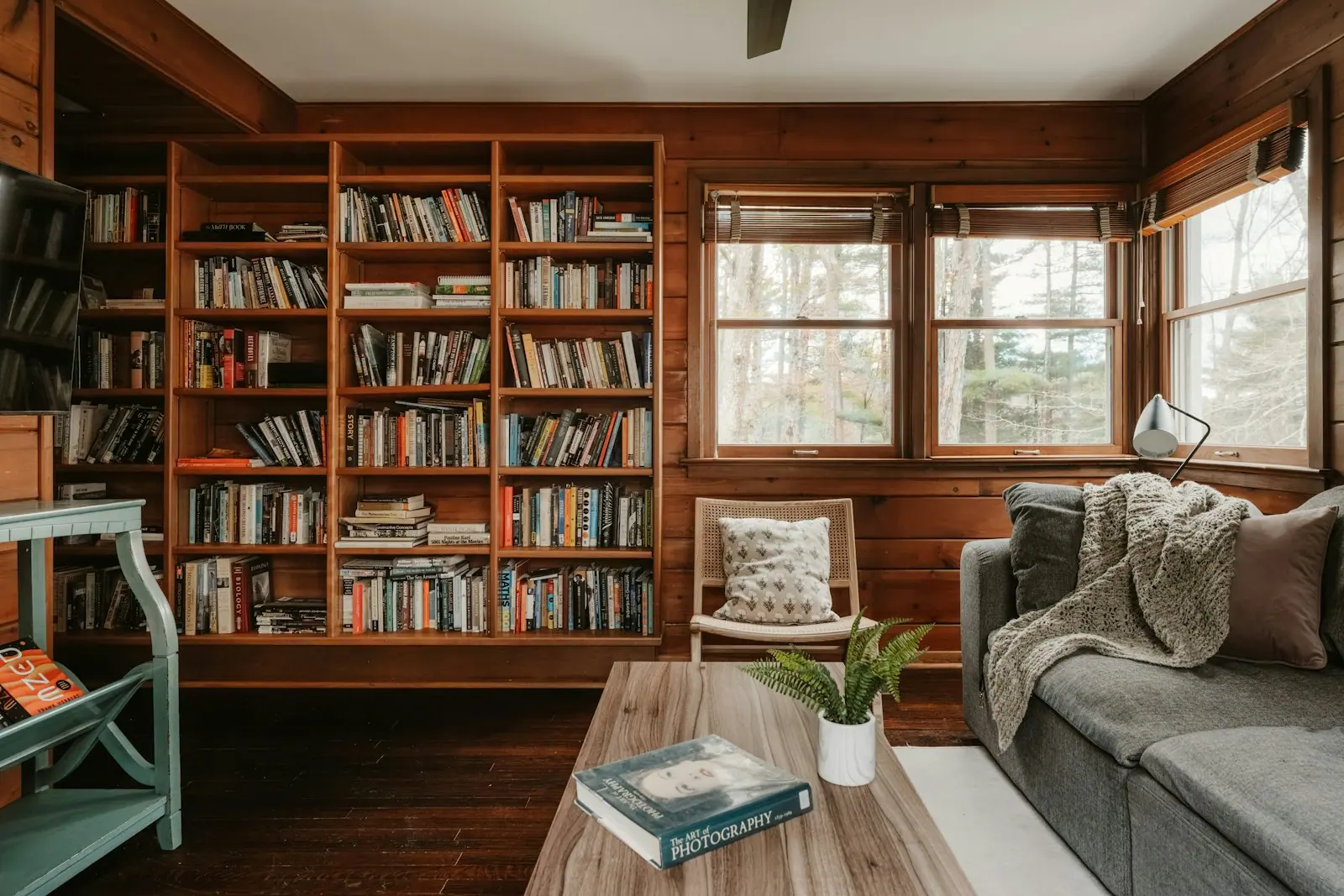 A quiet reading corner with wooden furniture and daylight