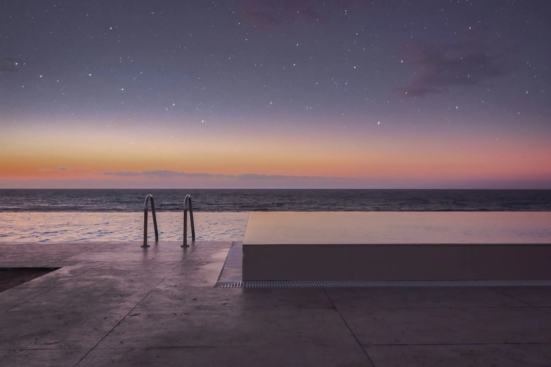 A calm pool set among planting in morning light