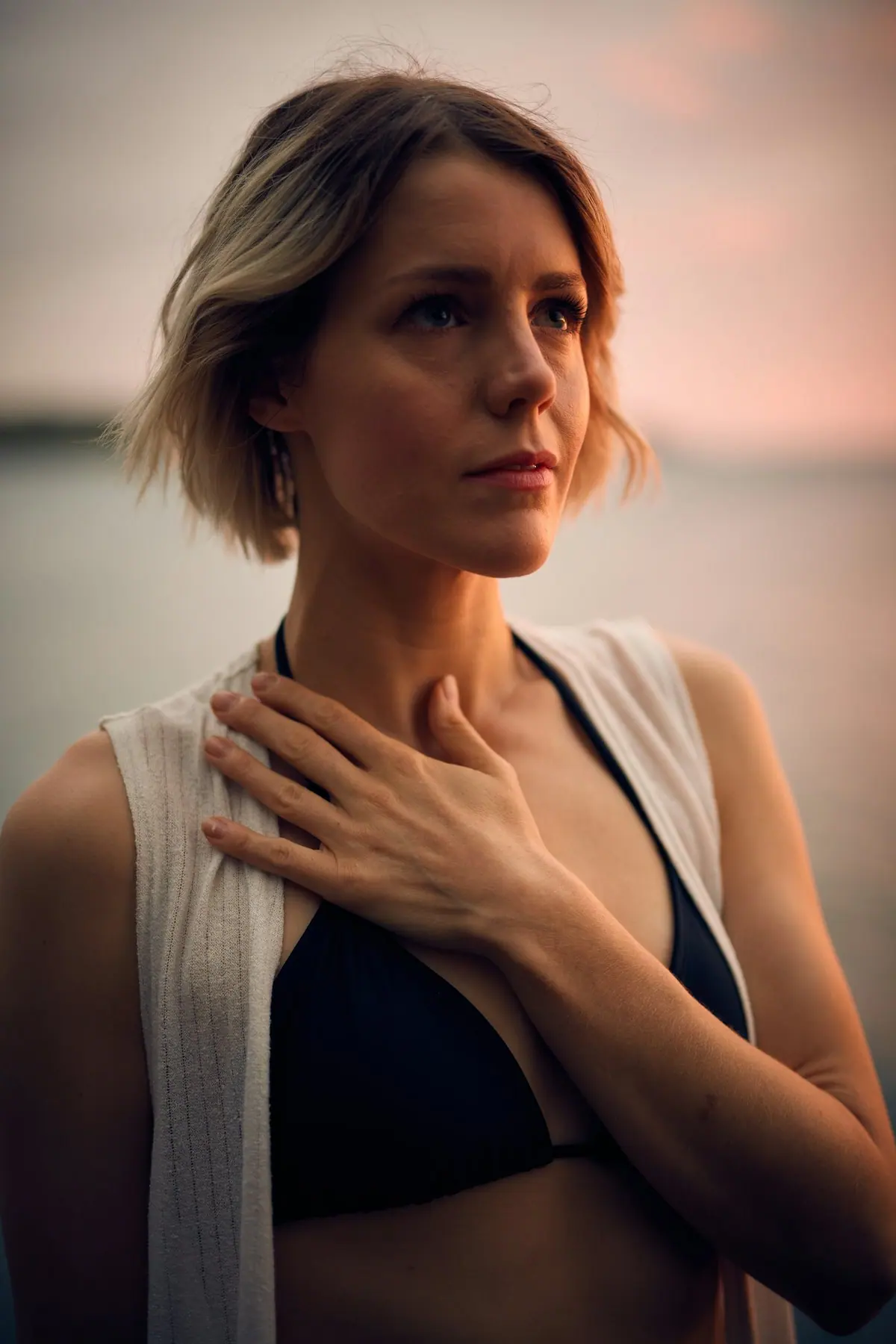 A person practising breathwork with hands resting on the chest